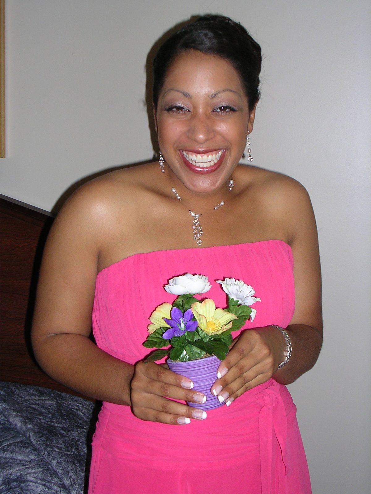 Tanya loves her little pot of fake flowers.